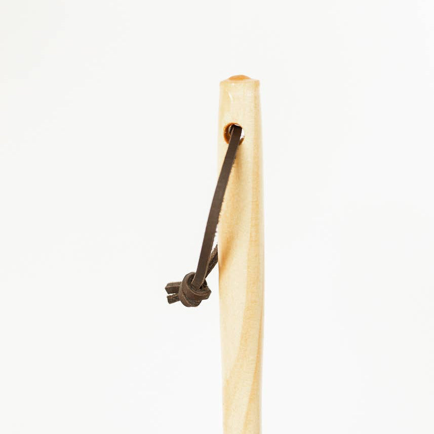 Detail of the feather duster's wooden handle and leather hanging loop.