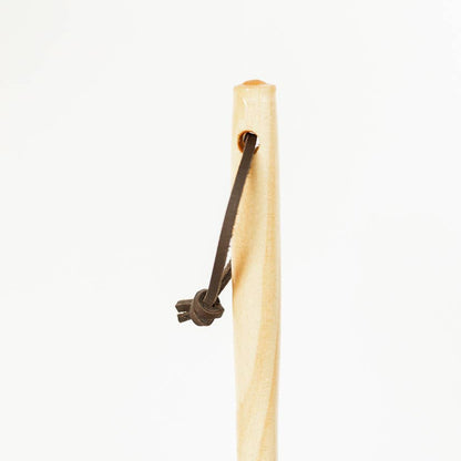 Detail of the feather duster's wooden handle and leather hanging loop.
