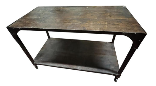 Dark console table viewed from above at an angle, with a mottled rectangular top, open lower shelf and small wheels.