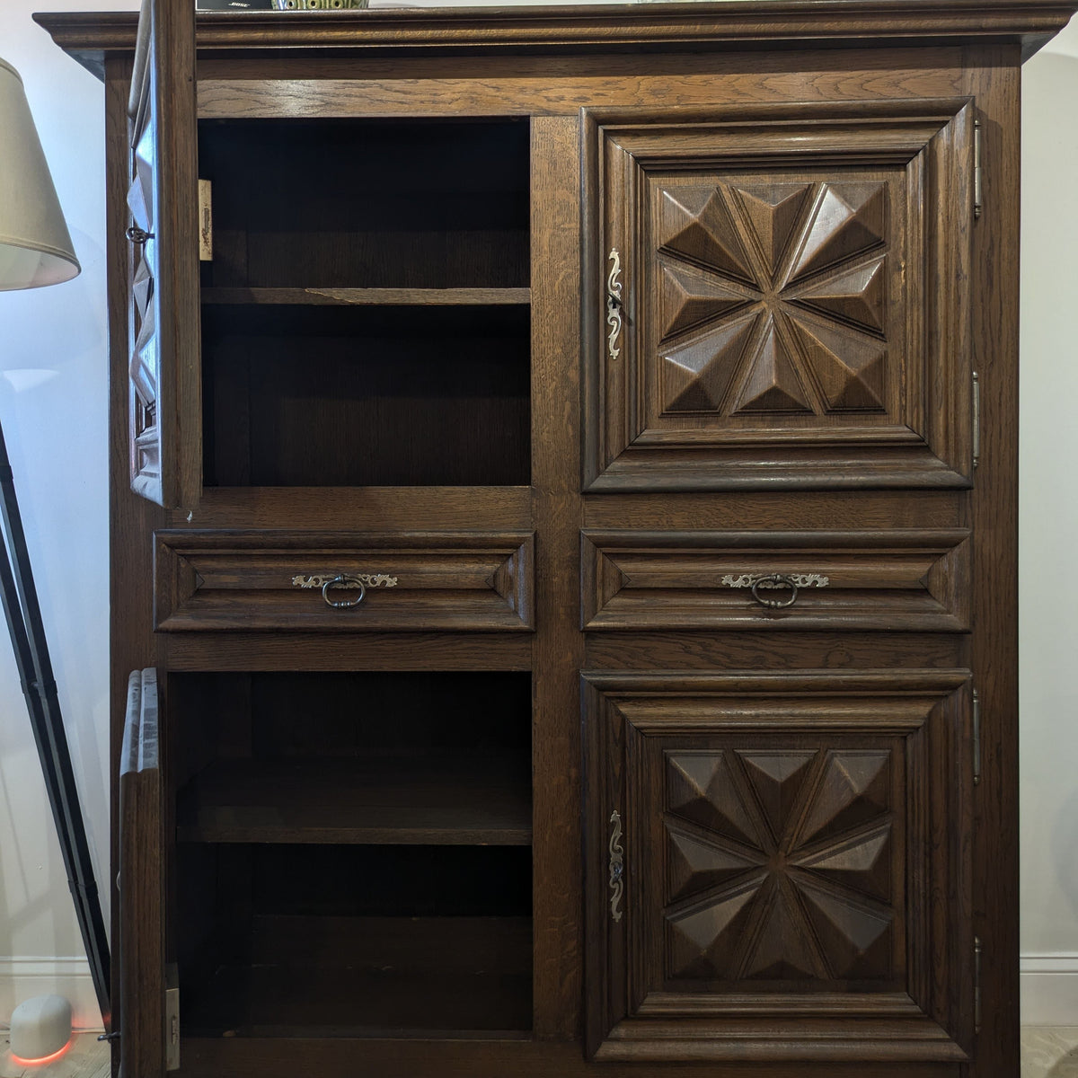 Izar Cabinet with its left upper and lower doors open, showing the interior shelves.