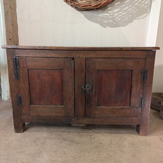 Head-on view of Montel Low Cabinet with its two paneled doors and metal latch.