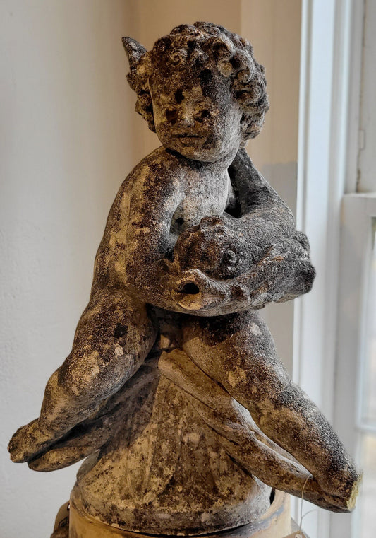 Concrete Water Sprite holding a fish, full sculpture view